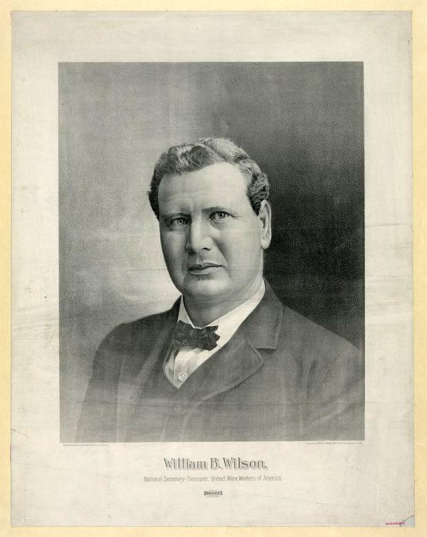 Photograph, head and shoulders, of Wilson wearing a suit and bowtie.