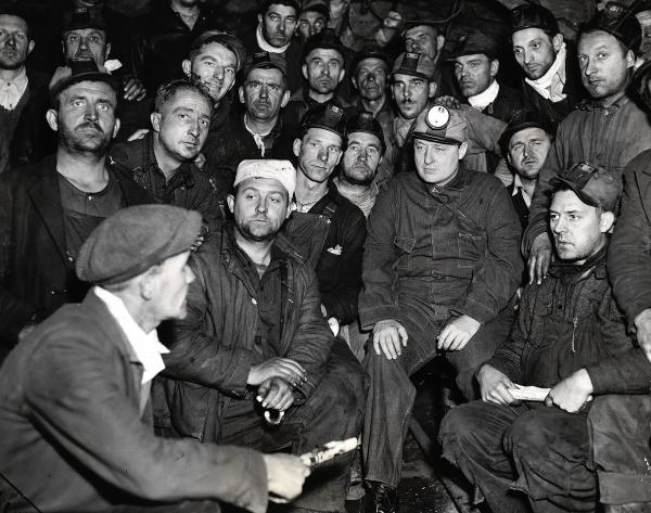 Pennsylvania-Governor George H. Earle of Pennsylvania, circular light on his cap, is pictured with the 38 "stay-down" miners who have self-imprisoned themselves 1300 feet underground in the Number 8 mine of the Lehigh Navigation Coal Company. 