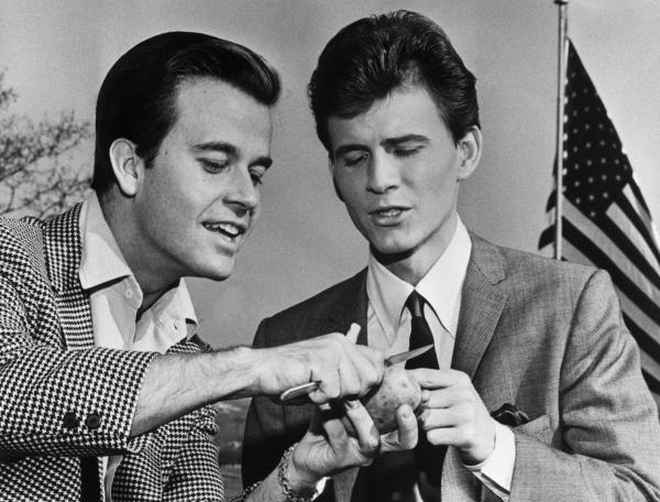 Dick Clark Showing Bobbie Rydell how to peel a potato