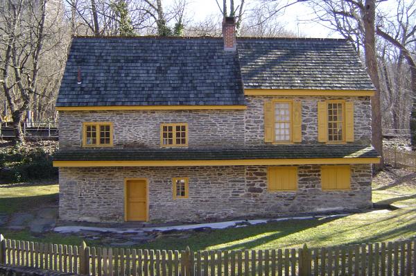 Color photograph of the restored homestead.