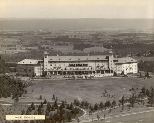 Aerial view; Hotel Hershey; front facade; trolley tracks; trees; cars