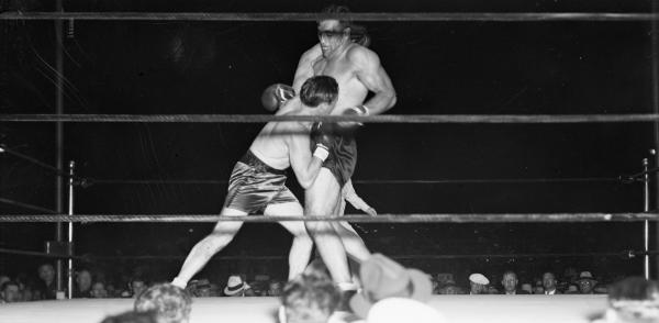 Tommy Loughran taking a swing at Primo Carnera. 