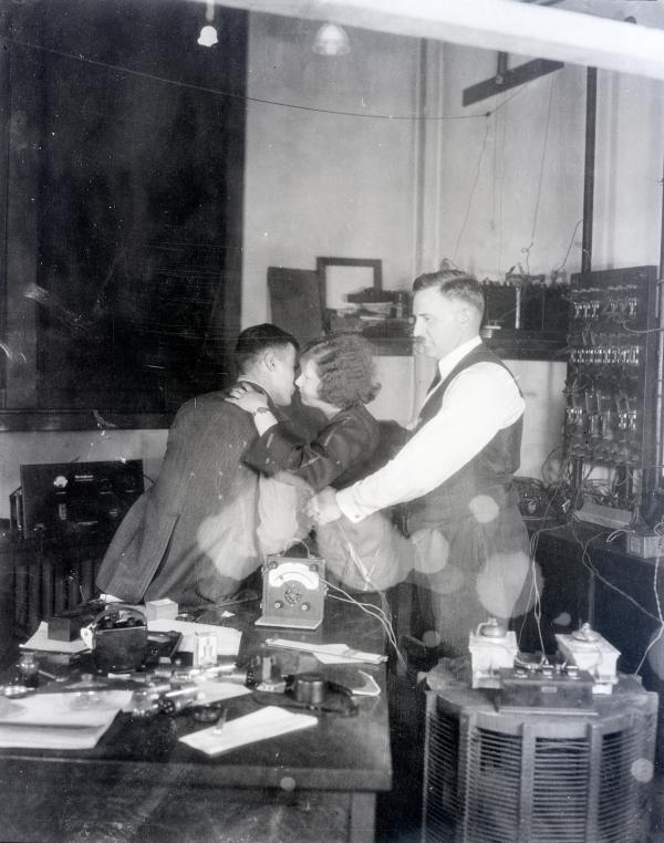 Dr.Thomas is shown in photo broadcasting from the Westinghouse Station to East Pittsburgh- station KDKA -the heart palpitations of the lover's kiss.