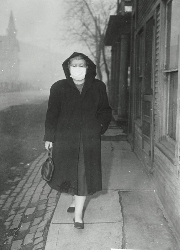 Woman Wearing Surgical Mask While Strolling on the Street. 