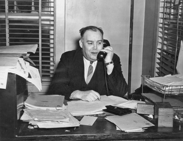 Local 506 Business Agent James Kennedy at desk on telephone.