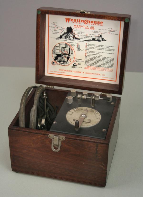 Color image of a radio set, with the lid open.
