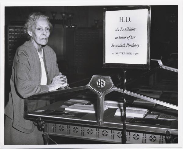 H. D. at Yale: photograph of Hilda Doolittle in Sterling Library at an exhibition in honor of her seventieth birthday, Yale University