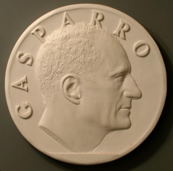 A relief medallion of Frank Gasparro in profile