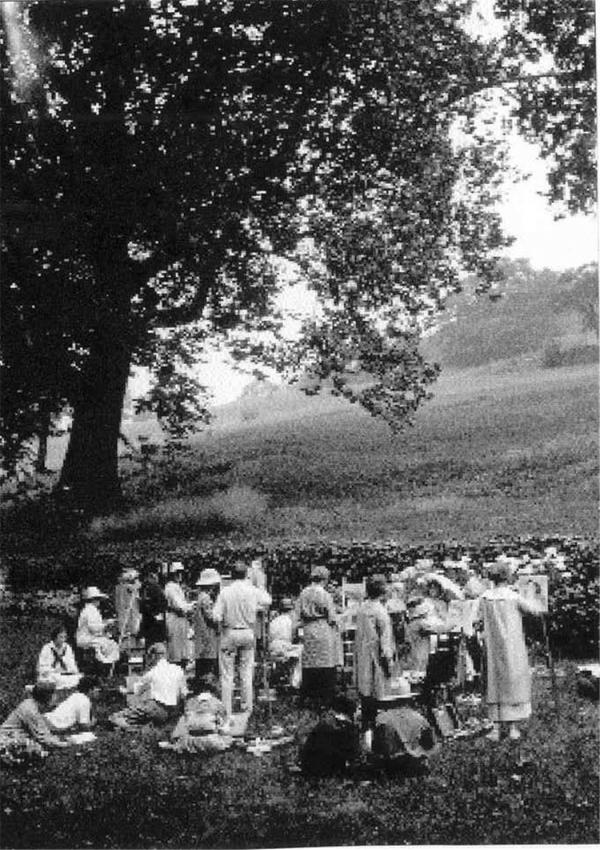 Black and white image of students creating paintings of the landscape  