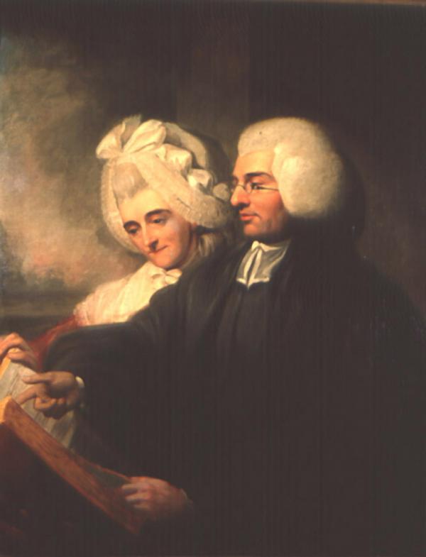 Oil on canvas of the Reverend Duché dressed in his clergy robe and reading the bible to his wife, who appears to listening attentively.