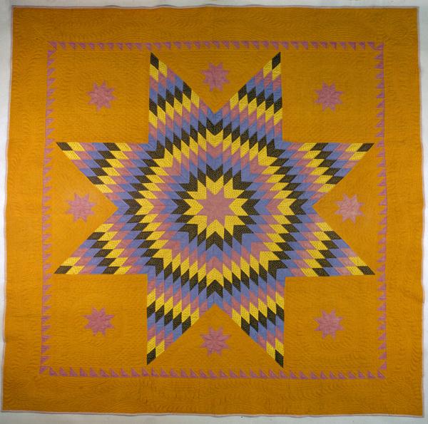 A quilt depicting the Star of Bethlehem pattern.