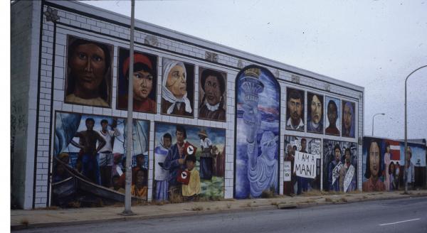 This mural traces the history of immigration in the United States and includes important figures in the civil rights movement who worked to bring harmony amongst all the different races and ethnic backgrounds making up this country.  The faces of many different cultures are represented in this mural. 