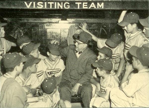 Black and white baseball card of the Pennsylvania Championship team from Monongahela and Branch Rickey in the dugout.