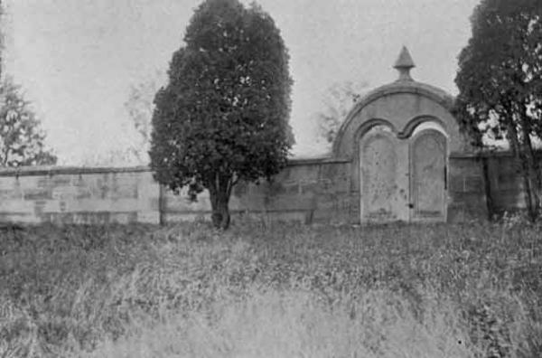 This wall and a pivoting stone gate define the perimeter of the Harmonist Society's cemetery in Butler County.