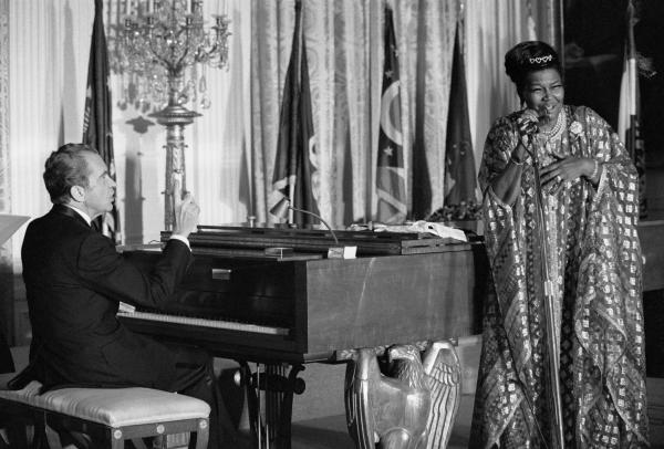 Richard Nixon plays the piano as Pearl Bailey sings.