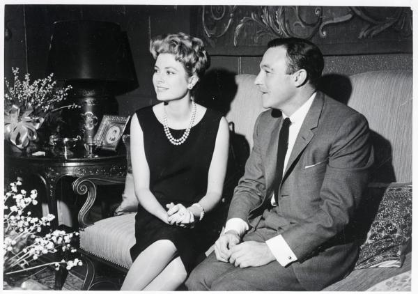 Image of Princess Grace and Gene Kelly sitting.