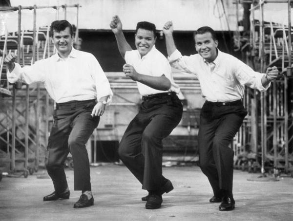 Chubby Checker, Conway Twitty, and Dick Clark Do the Twist.
