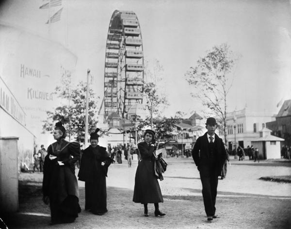 1893-Chicago Columbian Exposition with visitors in amusement park. Ferris wheel in background, 1893.  