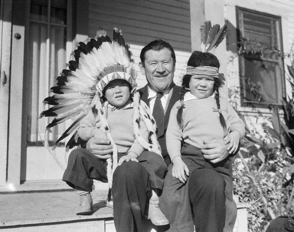 In this 1932 photograph, Thorpe's sons, Phil and Billy, have been cast in the role of stereotypical Indians.