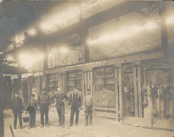 The Open Hearth Furnace crew (including children) at the Jones and Laughlin Steel Company,  1900.