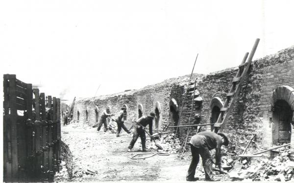Image of workers and the coke ovens.