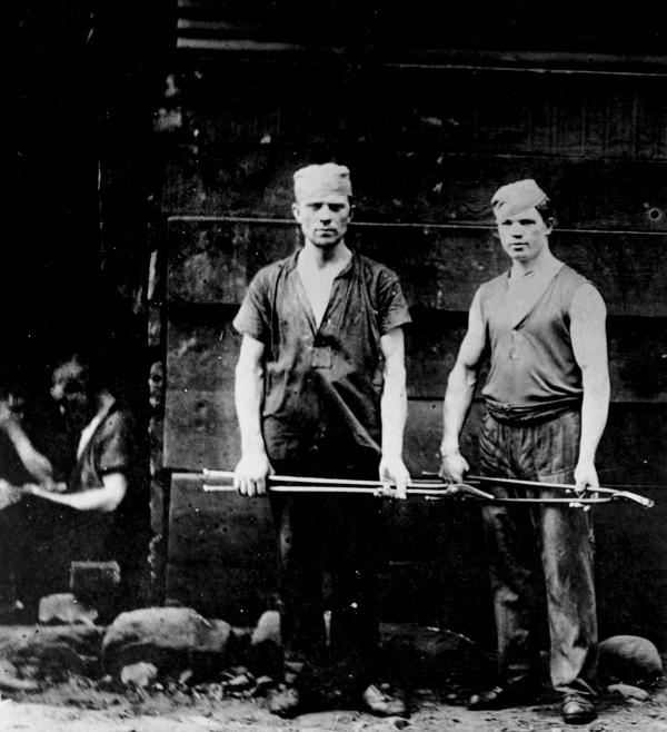 Image of two steel workers.