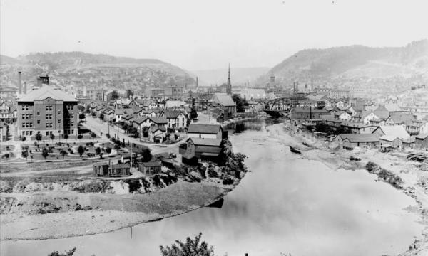 Black and white photograph of the Conemaugh River flowing through Johnstown.