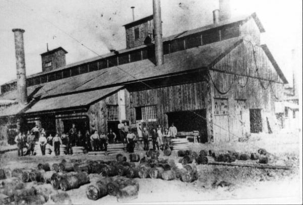A group of Freedom Forge workers and the Wheel Rolling Mill. 