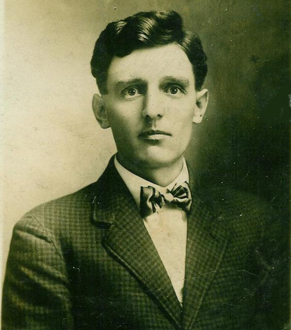 A photograph of Rosenkrans wearing a suit jacket, white shirt, and bowtie.