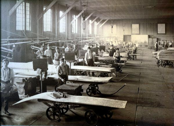 Workers with sample carts, inside of the American Sheet and Tin Plate Company, Vandergrift, 1913.