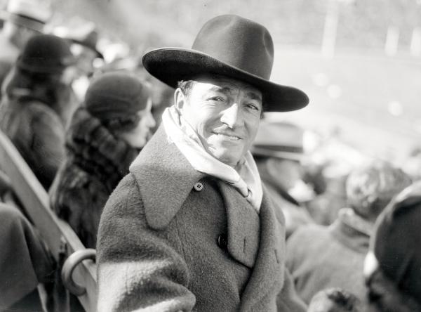  Wearing his famous cowboy hat, Tom Mix, popular actor, is seen here as he viewed the Notre Dame-University of Southern California football game at the Memorial Stadium in Los Angeles.