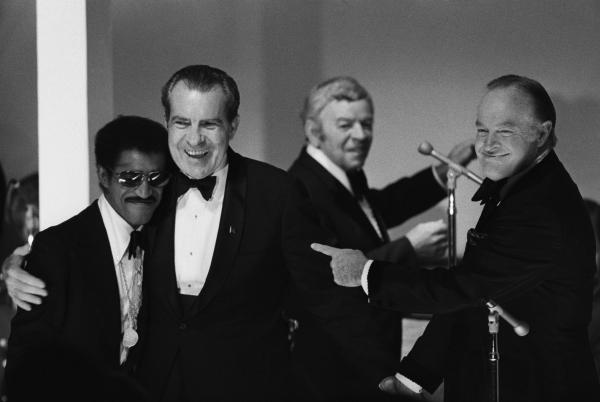 Les Brown, in the background, leading his band during a White House gala for returned American POWs from Vietnam, May 25, 1973. 

 