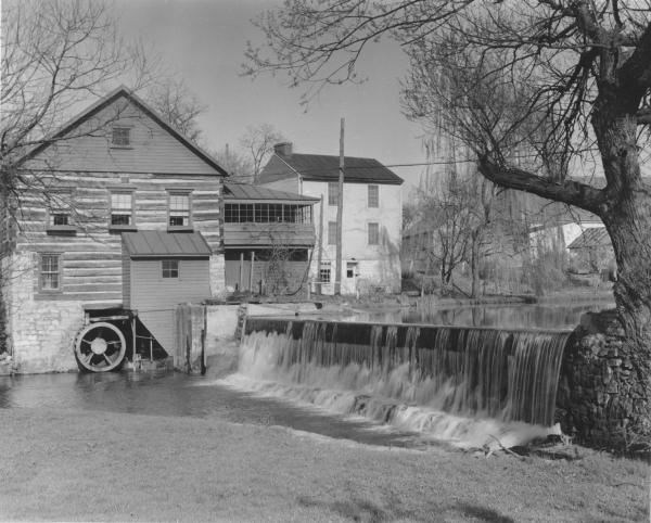 Laughlin Mill 1950s Black and White image of mill and water wheel along a creek.
