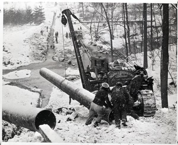 Pipeliners laying the "Big Inch" oil line at Brandywine Creek near Glen Moore, PA, winter, 1943. 