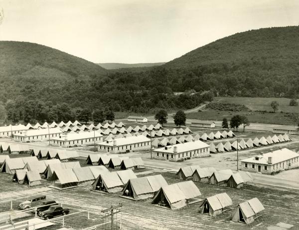 Rows of tents and brick buildings. The gap for which the reservation is named can be seen in the background