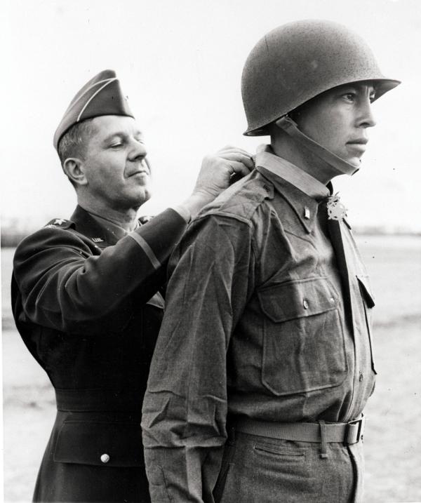 Black and white image of soldier receiving Medal of Honor from a General.