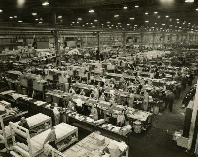 Huge interior factory image of workers.