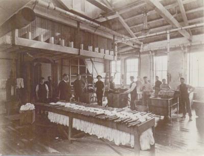 Image of men working inside the factory.