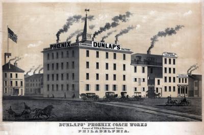 Carriage manufacturer and dealer. Smoke rises from seven chimneys of a four story main building. Rows of windows fill every floor, both in the front and sides of the building. Three other buildings of the cmplex are of simliar design. Carriages and people are in the foreground.