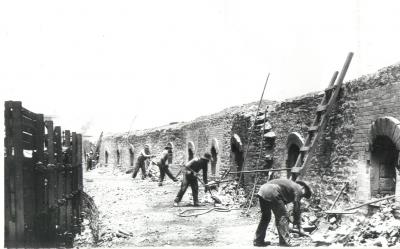 Image of workers and the coke ovens.