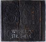 Photograph of a Cast-iron stove plate features the words "Wilhelm/Steigels".