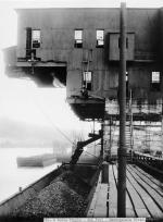  Coal being loaded into barges from a tipple.