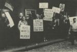 Protesting Miners carry hold signs that read "Boyle Wanted for Murder", "Boyle Stole Two Elections", and "Bloody Paid Killers".