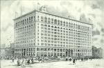 A black and white drawing of the exterior of a multi-floored department store. The bottom floor has large white columns and the top floor has large arched windows. Flags and a radio antenna sit on top of the building. The street is filled with cars, people on horseback, and wagons. The walkways are  filled with people.