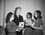Mrs. Harry S. Truman, wife of the President, opens the 1951 Girl Scout cookie sale by accepting the first box of cookies at Blair House from three representatives of the National Capital Federation of Girl Scouts. L to r are Tommie Andersn, 12, Mrs. Truman, Gloria Williams and Joy Rice.