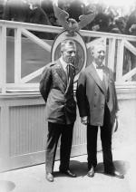Al Smith and Smedley Butler dressed in suits pose for this photograph.