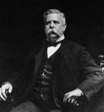 Black and white version of a portrait of Westinghouse wearing a suit and seated.