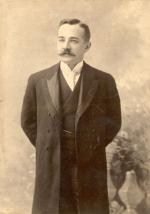 Milton S. Hershey, wearing suit;  3/4 length portrait.