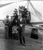 Harold F. Pitcairn, President of Pitcairn Aviation Company, standing in front of strange, Windmill autogiro plane that he piloted on first long trip from Philadelphia to Washington
