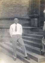 Homestead swim coach Jack Scarry standing on the steps of the Homestead Library.   